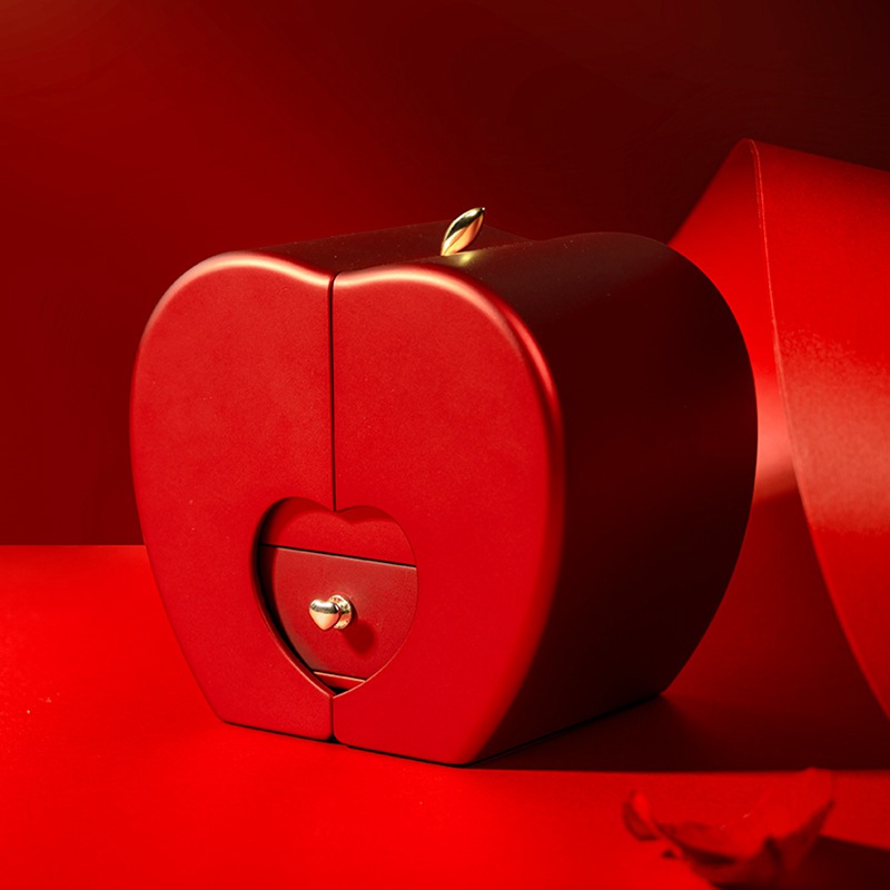 The closed red apple box with its heart-shaped drawer front